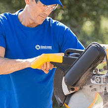 handyman using power saw